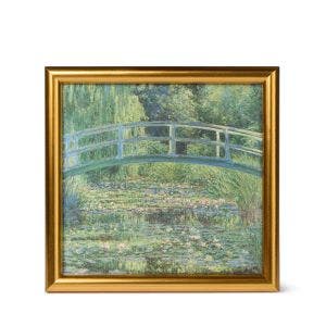 A gold framed print showing the painting.