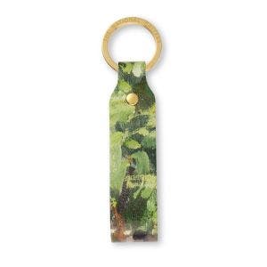 A leather loop keyring showing green brushstroke details from Monet's Bathers at La Grenouillère. Suspended on a gold colour ring has The National Gallery engraved on it.