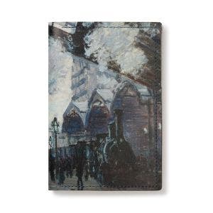 The front side of the leather passport holder, showing the train detail from Monet's painting  The Gare St-Lazare.