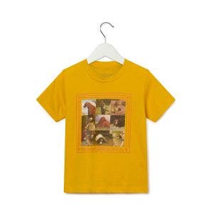 A yellow children's tshirt on a hanger with pictures of dogs from paintings.