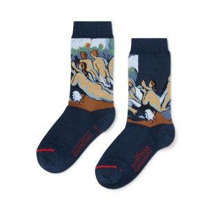 Two navy blue socks laid flat.