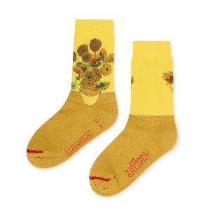 A pair of yellow and gold socks with an image of the National Gallery Sunflowers stitched on.