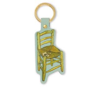 A dye-cut Van Gogh's Chair keyring made from recycled leather and suspended on a gold colour ring with The National Gallery engraved on
