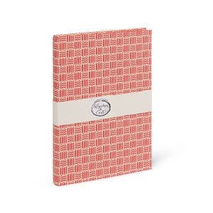 A notebook with a wavy red patterned design.