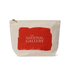 A white cotton pouch bag with a sturdy zip and splash of vermilion.