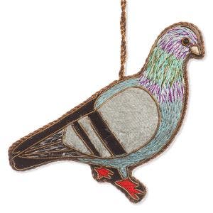 A embroidered and gold threaded decoration of a pigeon.