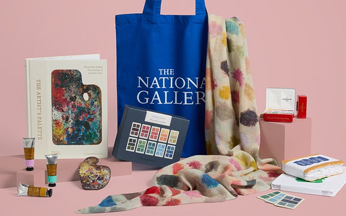Bright colours and art materials including books, scarves and paints.